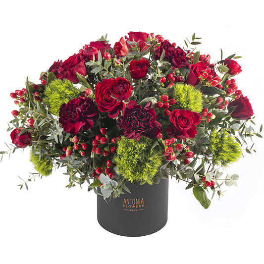 Flowerbox Stromboli con rose rosse, garofani, bacche rosse e verde ornamentale